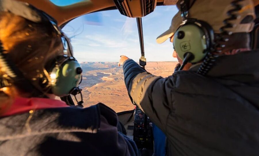 Moab: Canyon Country Sunset Helicopter Tour - Corona Arch and the Potash Ponds glow: the sunset payoff