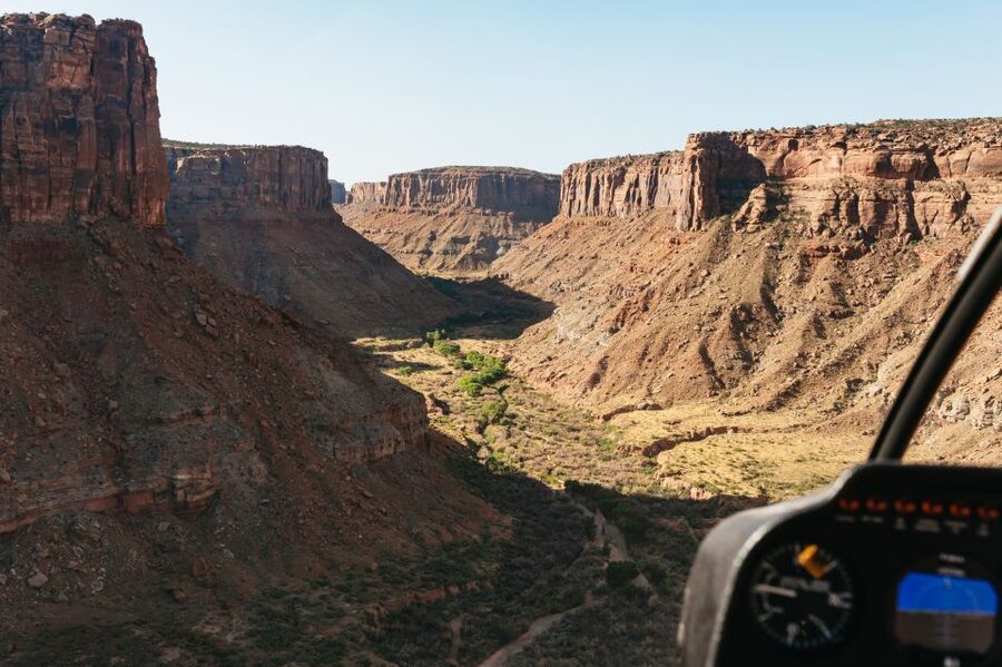 Moab: Corona Arch Canyon Run Helicopter Tour - The opening flight: Determination Towers and Gemini Bridges
